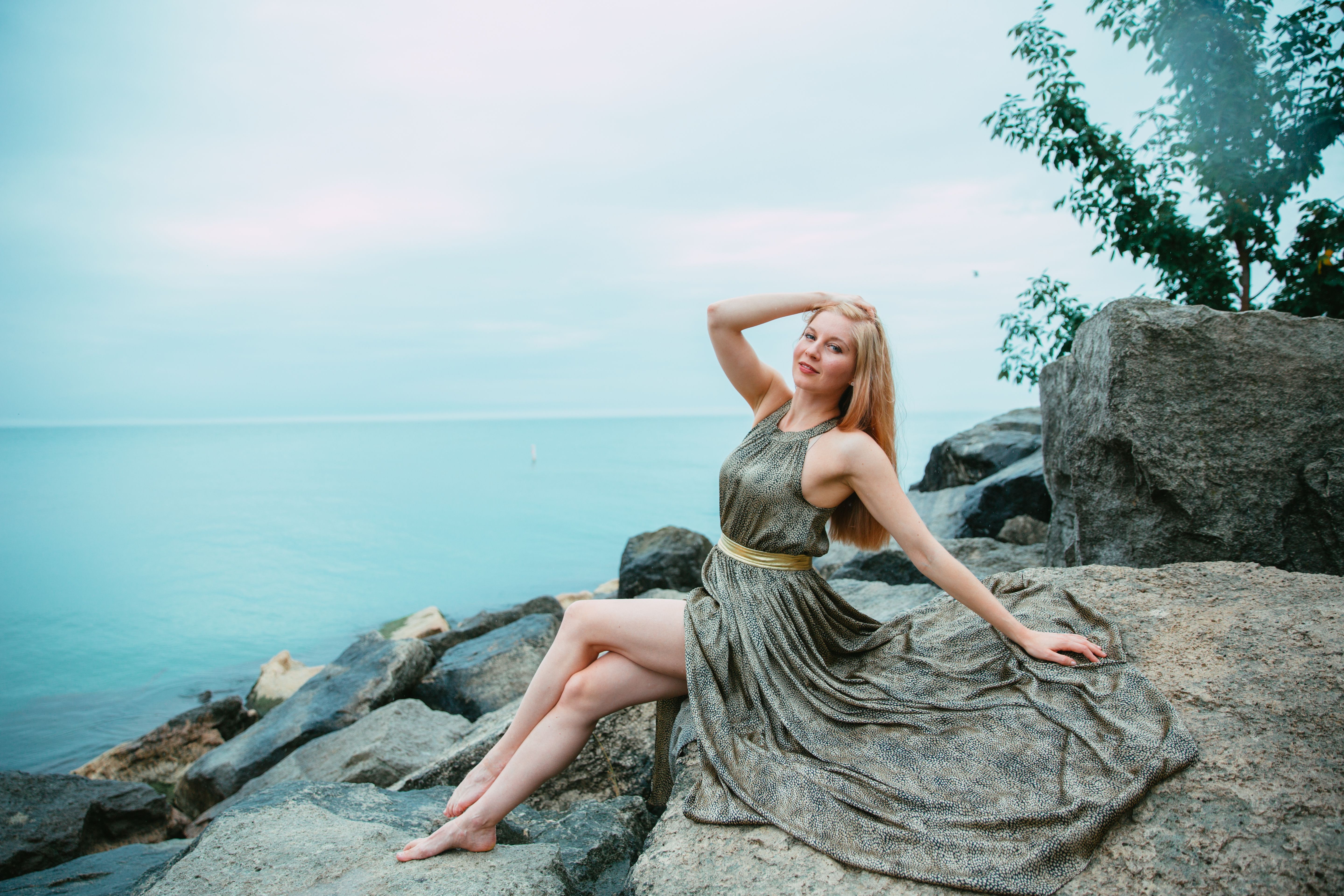 Woman Sitting on a Rock · Free Stock Photo