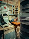 Man Asleep in Shop Amidst Religious Artifacts