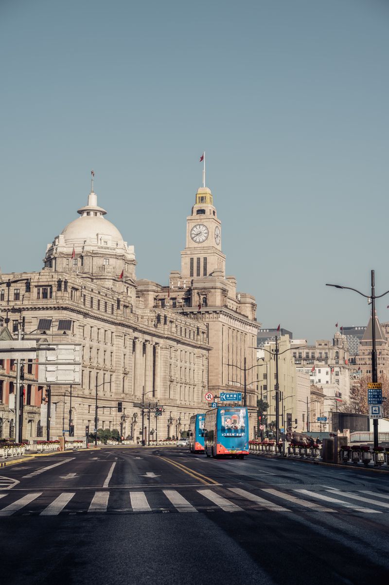 Historic Bund buildings and clock tower in Shanghai at daytime