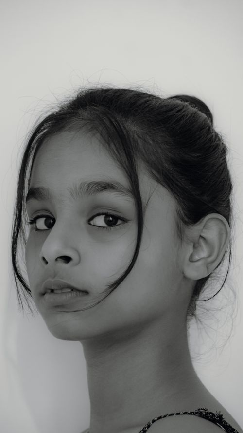 Free Black and white portrait of a young girl in thoughtful expression. Stock Photo