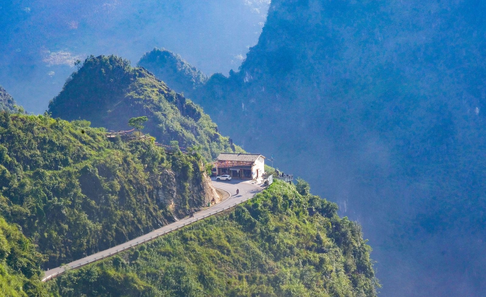 Scenic mountain view in Ha Giang with clouds and layered hills for travel photography