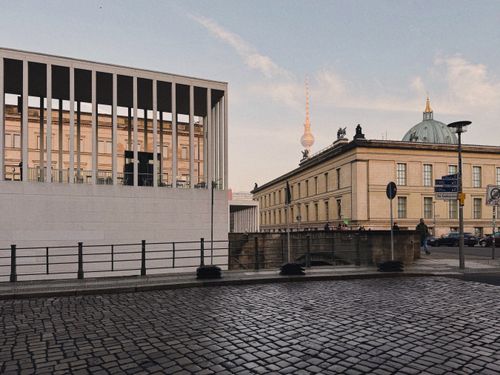 Free Modern and classic Berlin architecture featuring the iconic Fernsehturm under a clear sky. Stock Photo