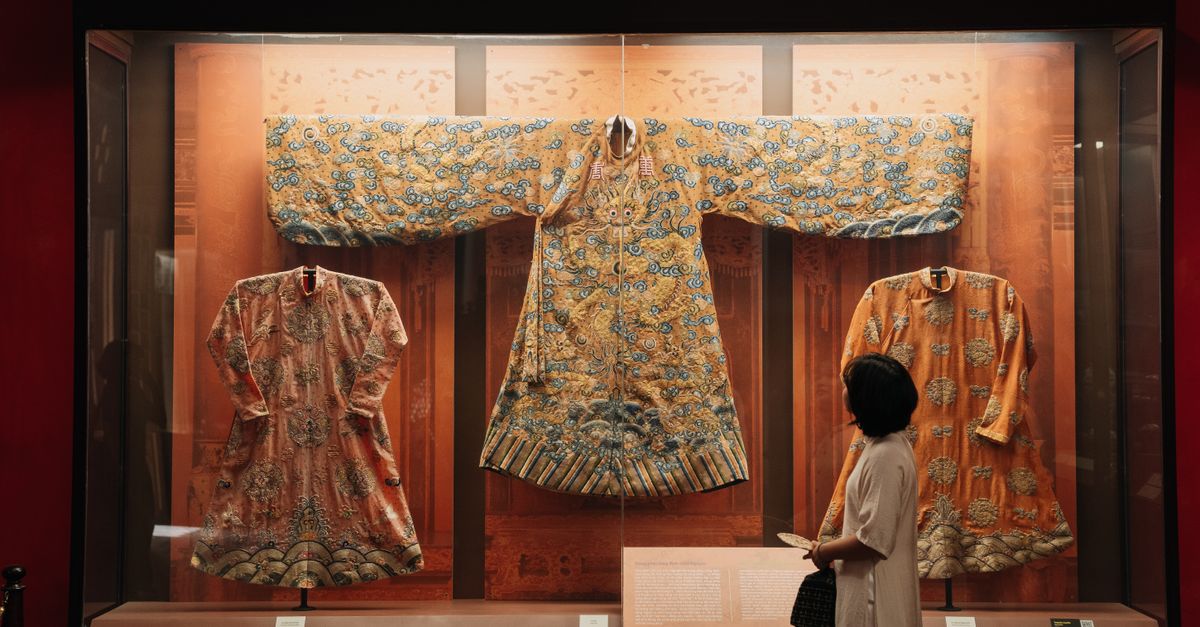 Chinese Robe Display Rack Traditional Chinese Robes in Museum Display · Free Stock Photo