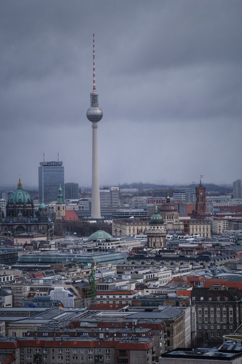 Free Aerial view of Berlin skyline featuring iconic TV Tower and historic architecture. Stock Photo