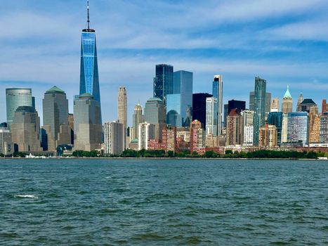 Stunning view of Manhattan's skyline captured from the Hudson River in daylight.