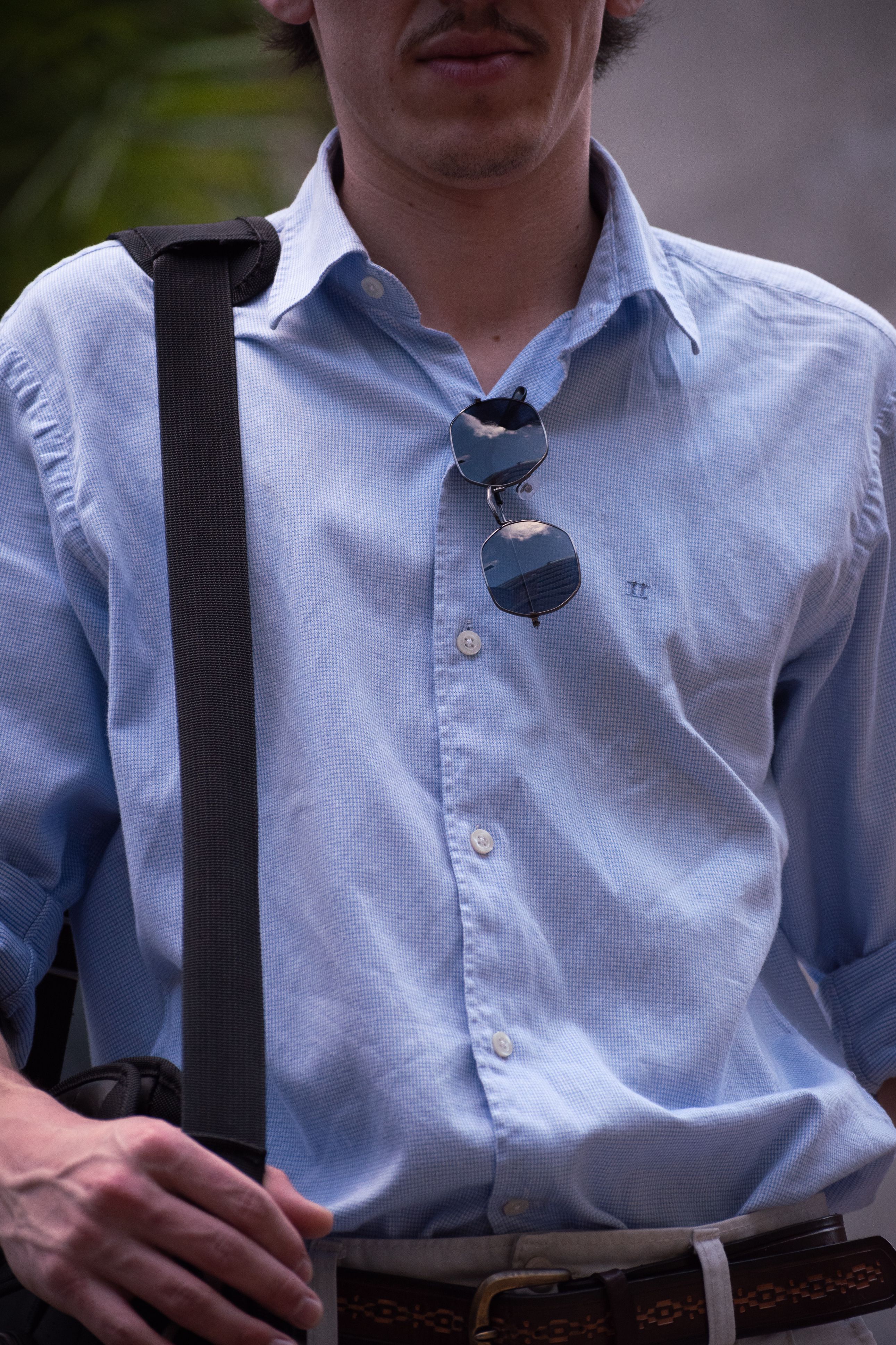 Portrait of a stylish young man wearing sunglasses, outdoors in Buenos Aires.