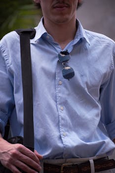 Portrait of a stylish young man wearing sunglasses, outdoors in Buenos Aires.