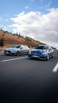 Dynamic shot of two Mercedes-Benz cars racing on a highway near Ankara, Türkiye.
