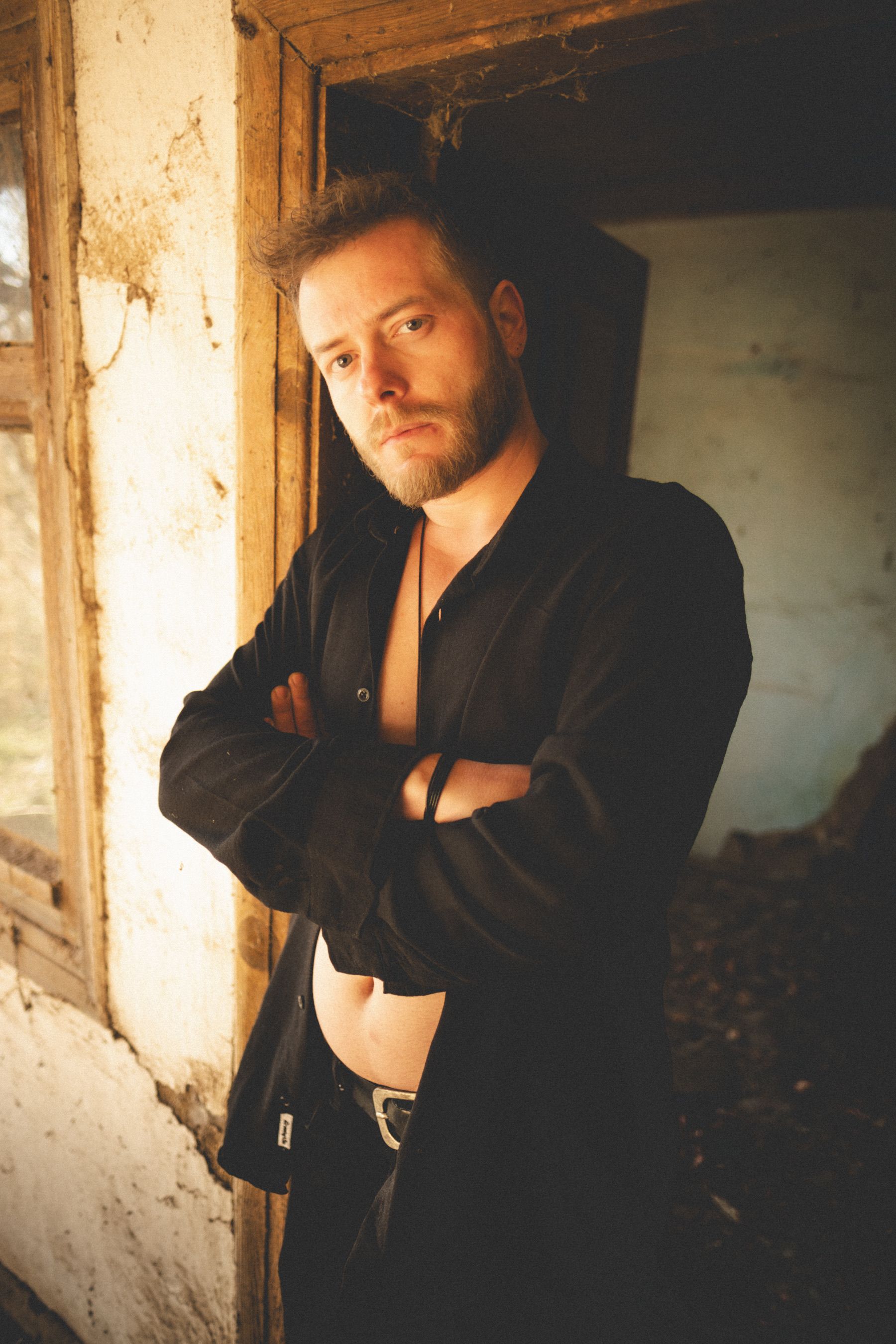 Portrait of a Thoughtful Man in Rustic Setting · Free Stock Photo