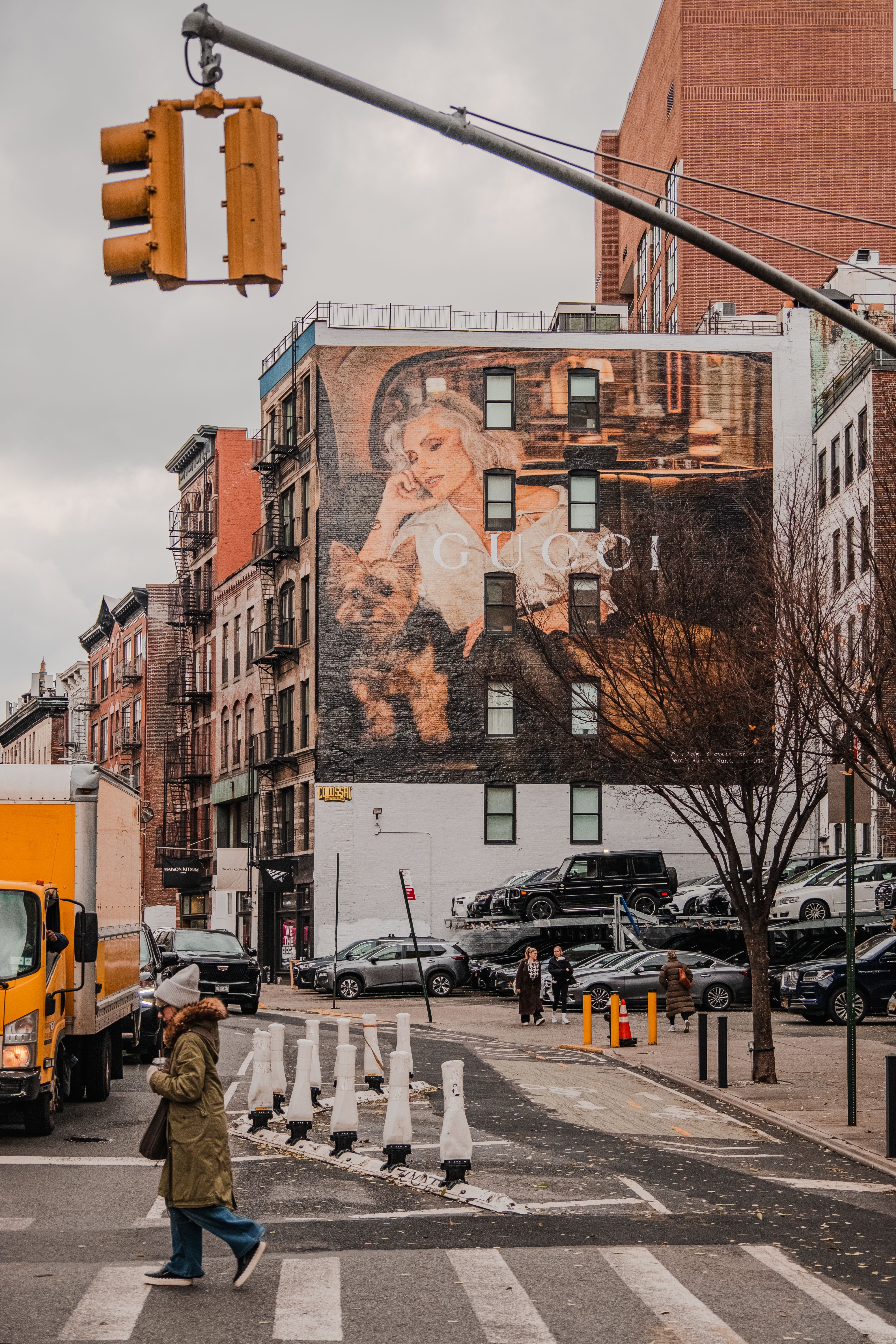 Urban Street with Large Mural and Pedestrian · Free Stock Photo