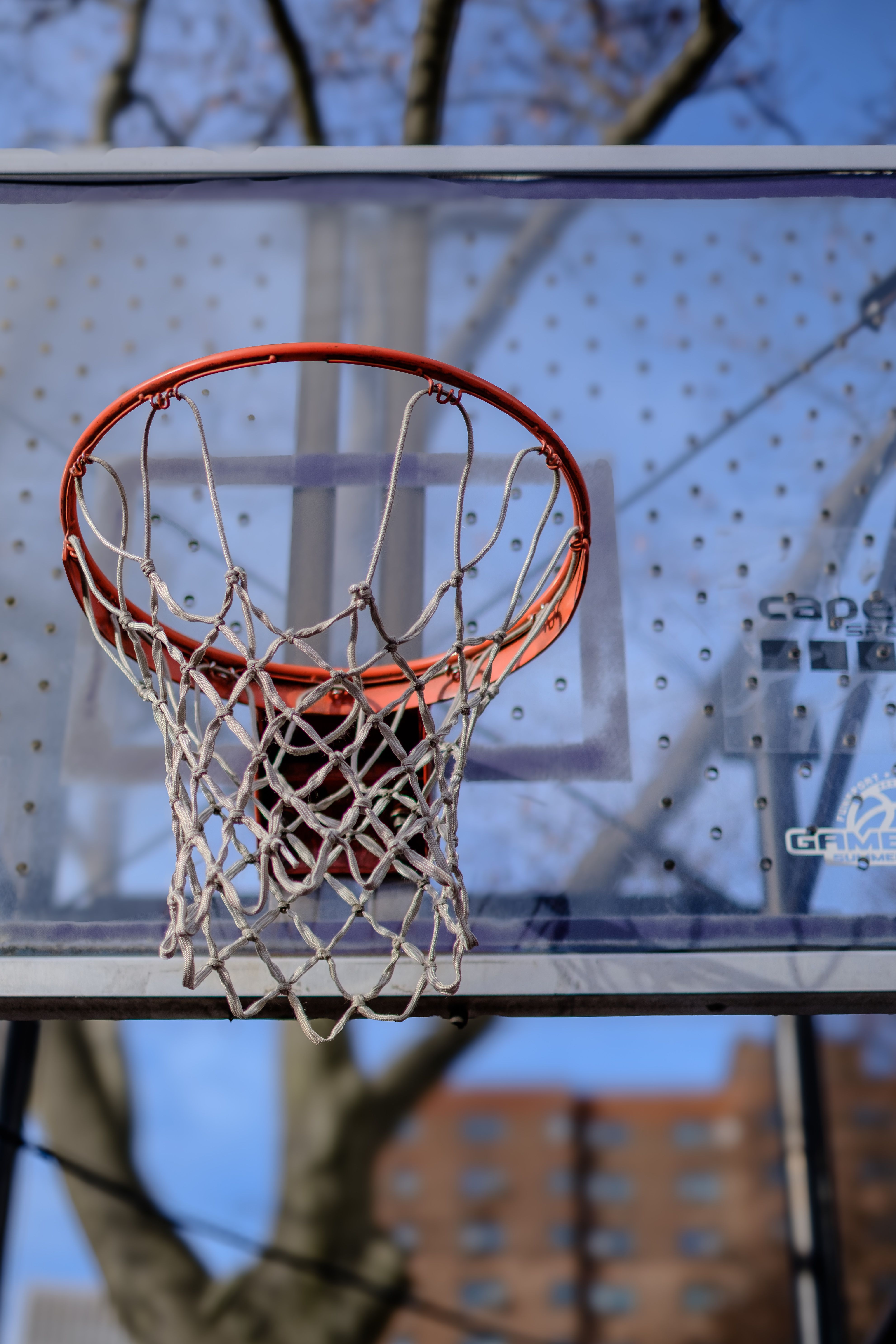Outdoor Basketball Hoop with Net Against Sky · Free Stock Photo