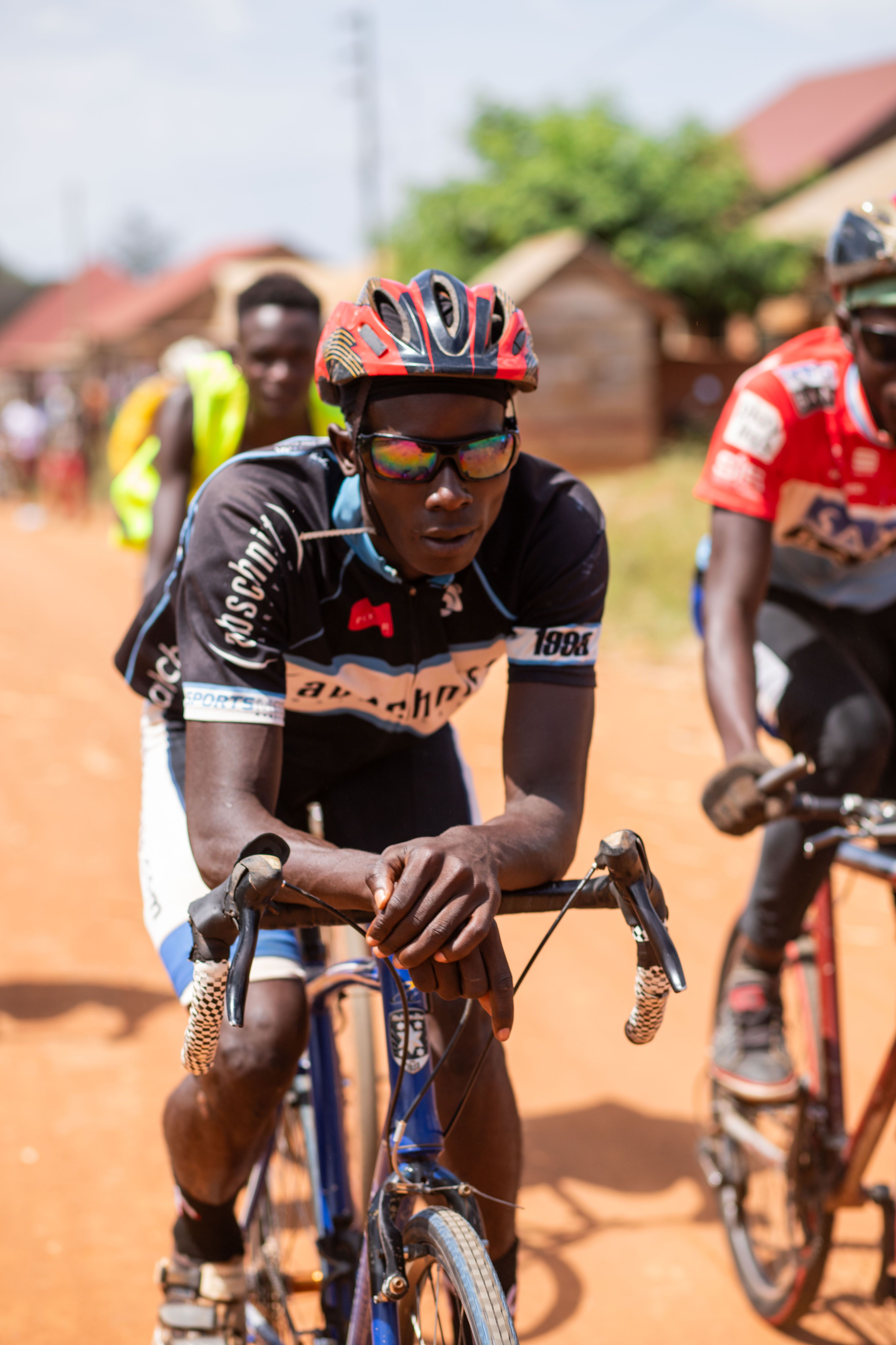 Cyclists racing on a rural road.