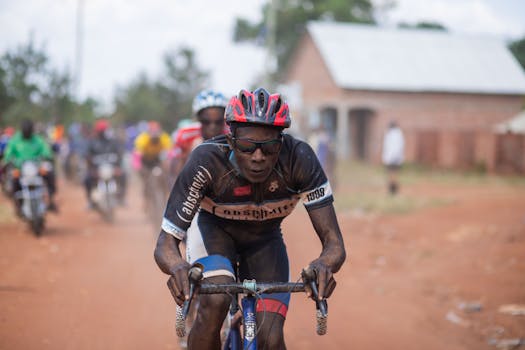 Intense cycling race on a rustic dirt road, showcasing determination and endurance.
