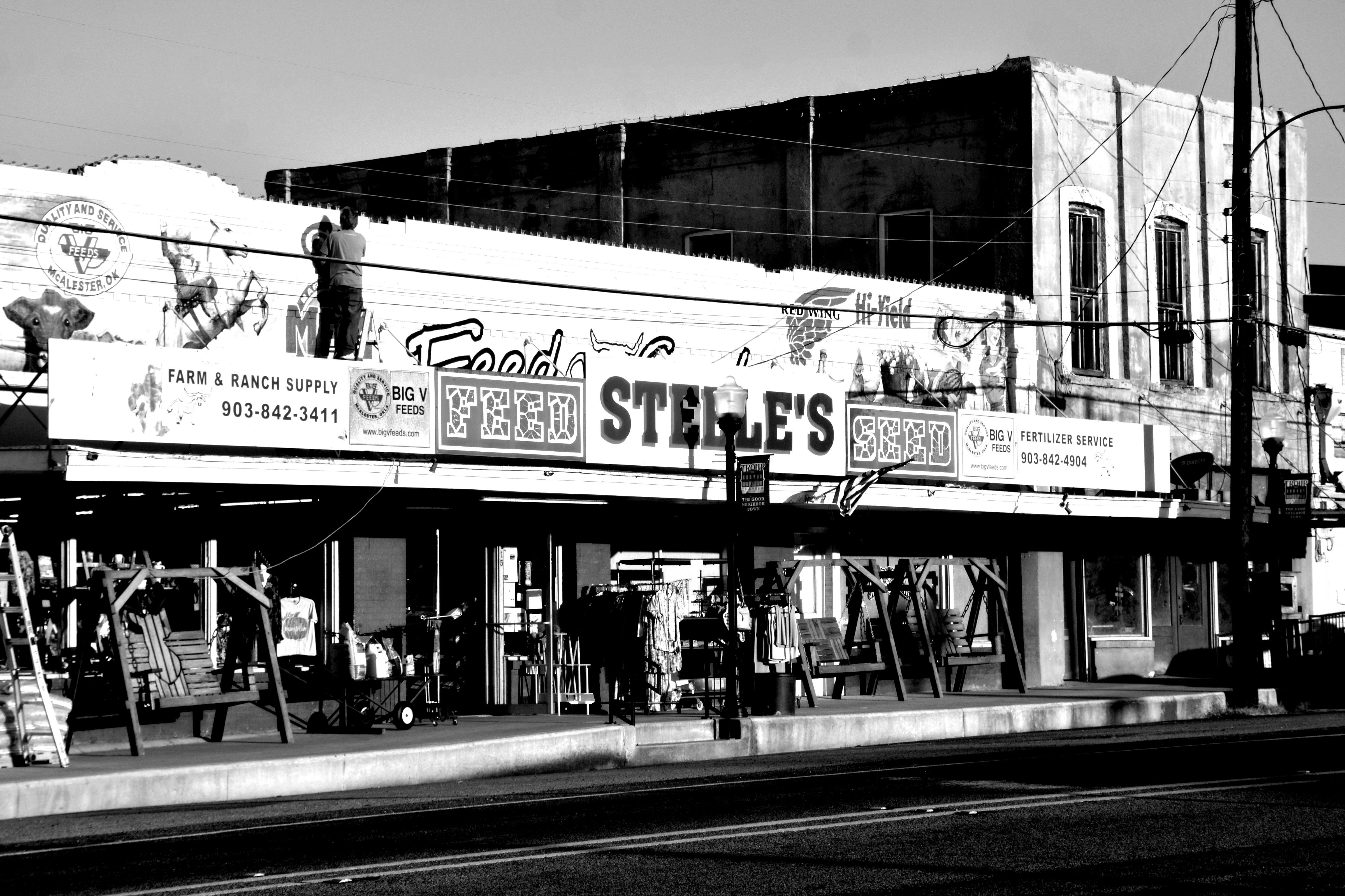 Black and white image of Steele's Feed Store capturing a classic rural Texas setting.