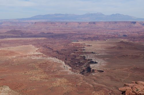 Free Expansive desert view of red rock formations and canyons in Canyonlands National Park. Stock Photo