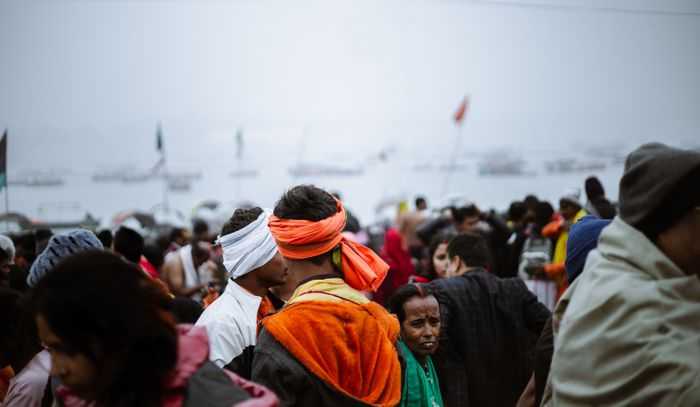 A large community gathering at a riverside