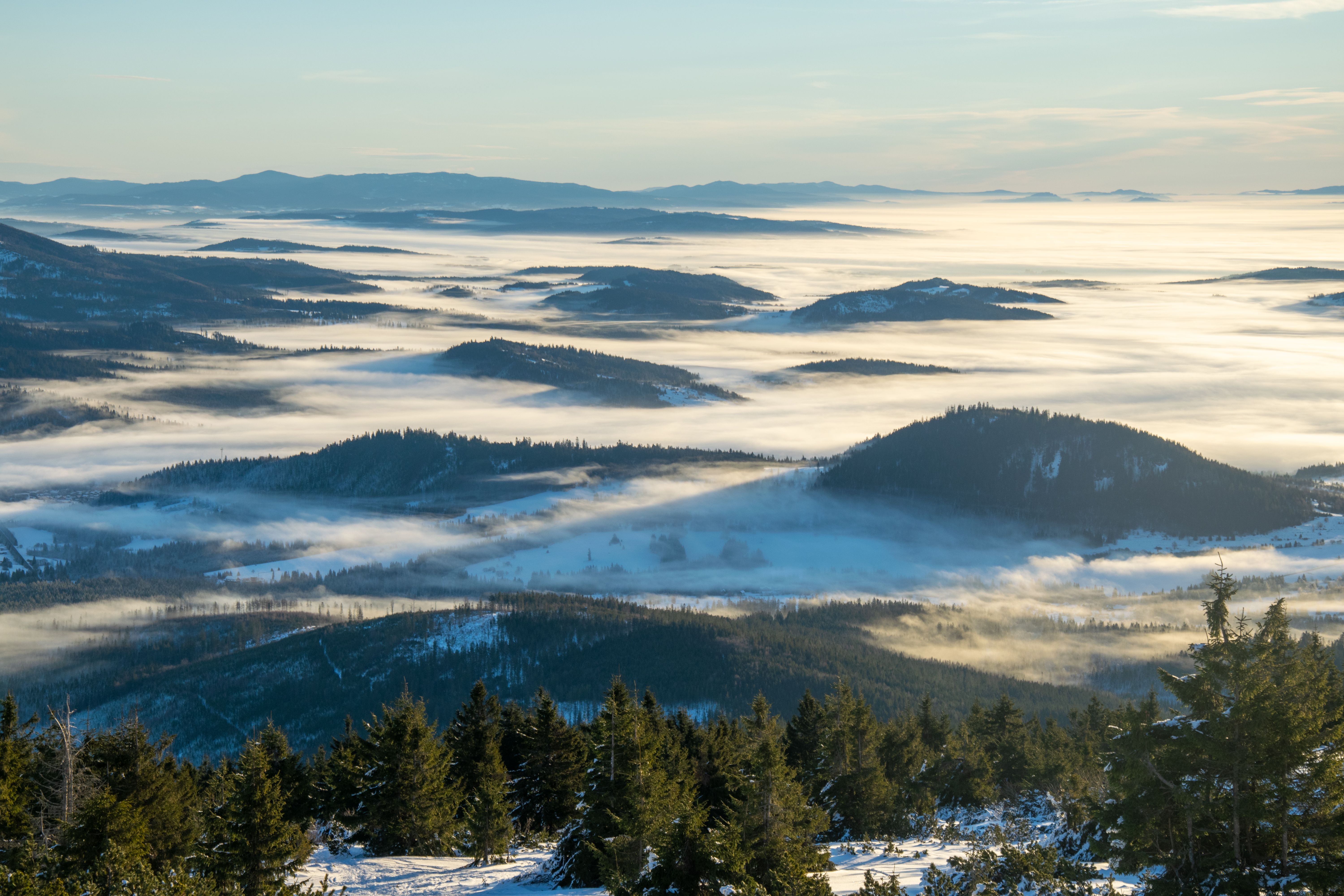 Person's visible breath forming mist on a cold winter morning