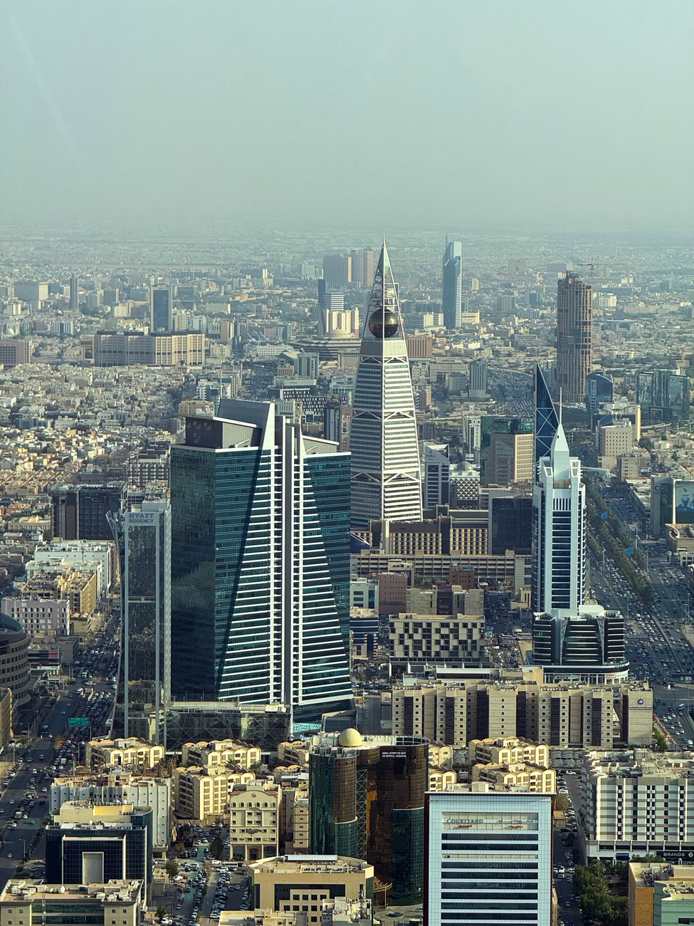 Riyadh's skyline, where state-backed construction and finance ambitions now face tighter budget scrutiny.