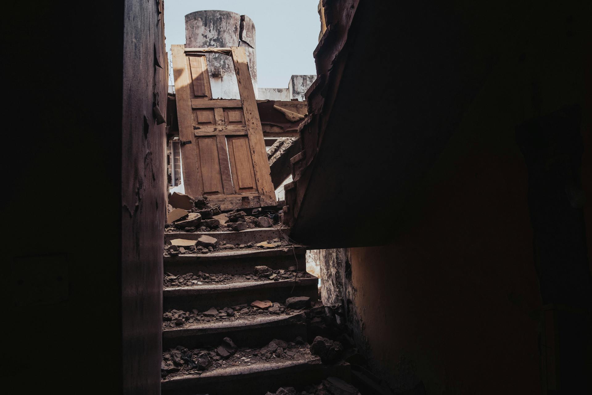 A view of a destroyed staircase amid rubble from a collapsed building in Ibadan, Nigeria.