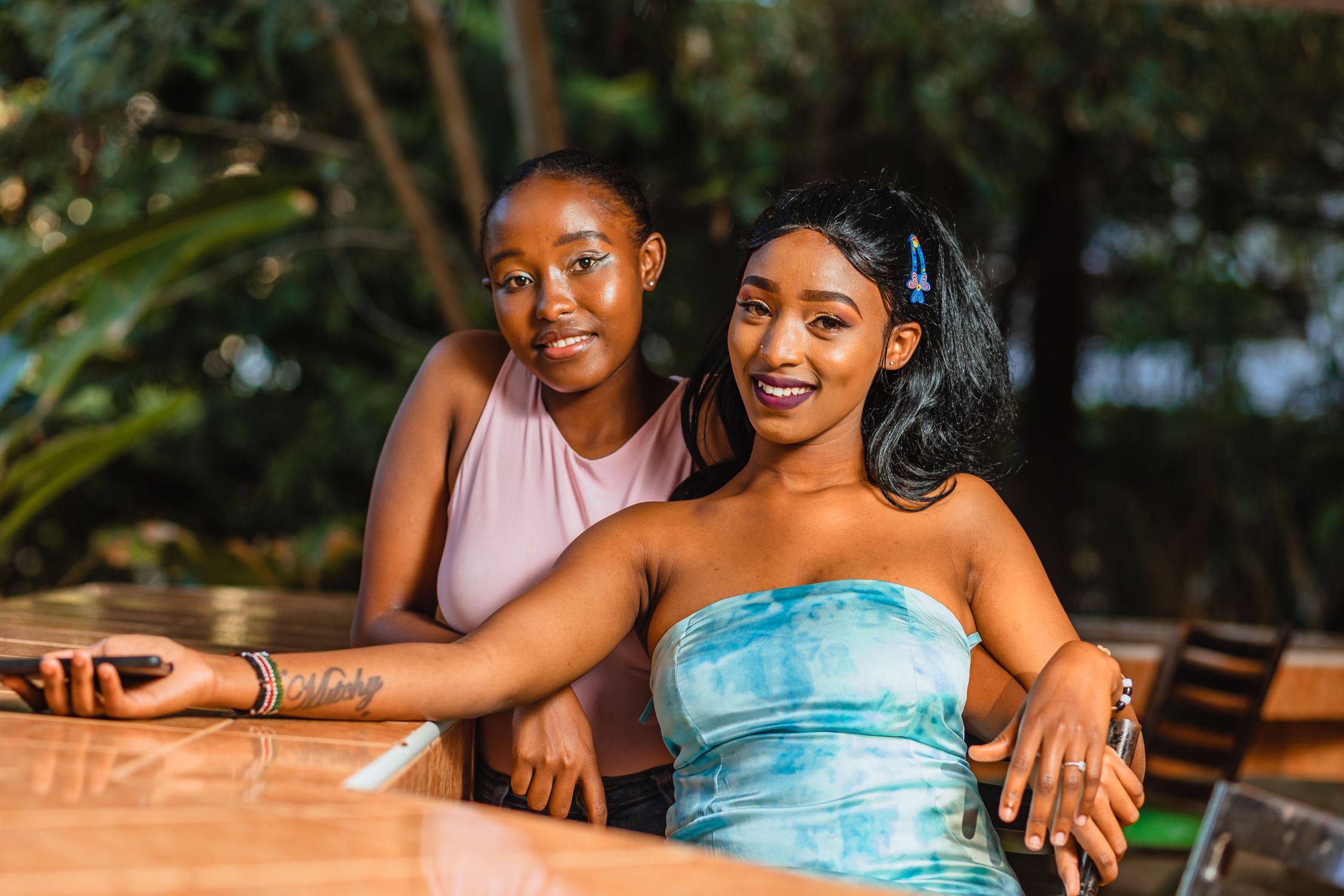 Two Friends Enjoying Outdoor Daytime Setting · Free Stock Photo