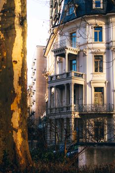 Elegant classic architecture of a building in Frankfurt captured at dusk with warm lighting.