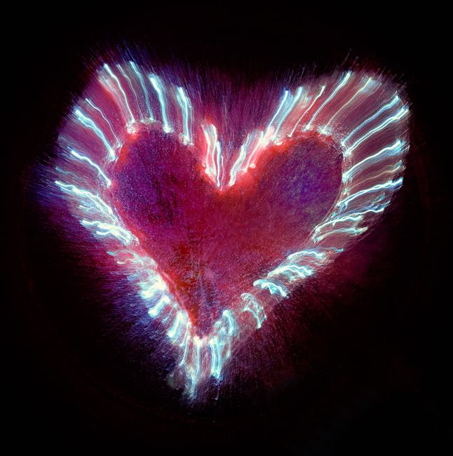 A dynamic heart-shaped light pattern, symbolizing love and energy.