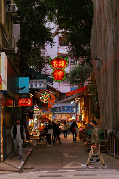 Free Vibrant Hong Kong alley with neon signs at night, showcasing urban culture and busy lifestyle. Stock Photo