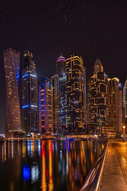 Photo of City Buildings During Night