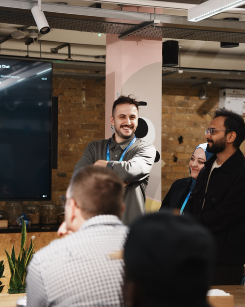 Free A diverse team engaging in a lively presentation in a modern office environment. Stock Photo