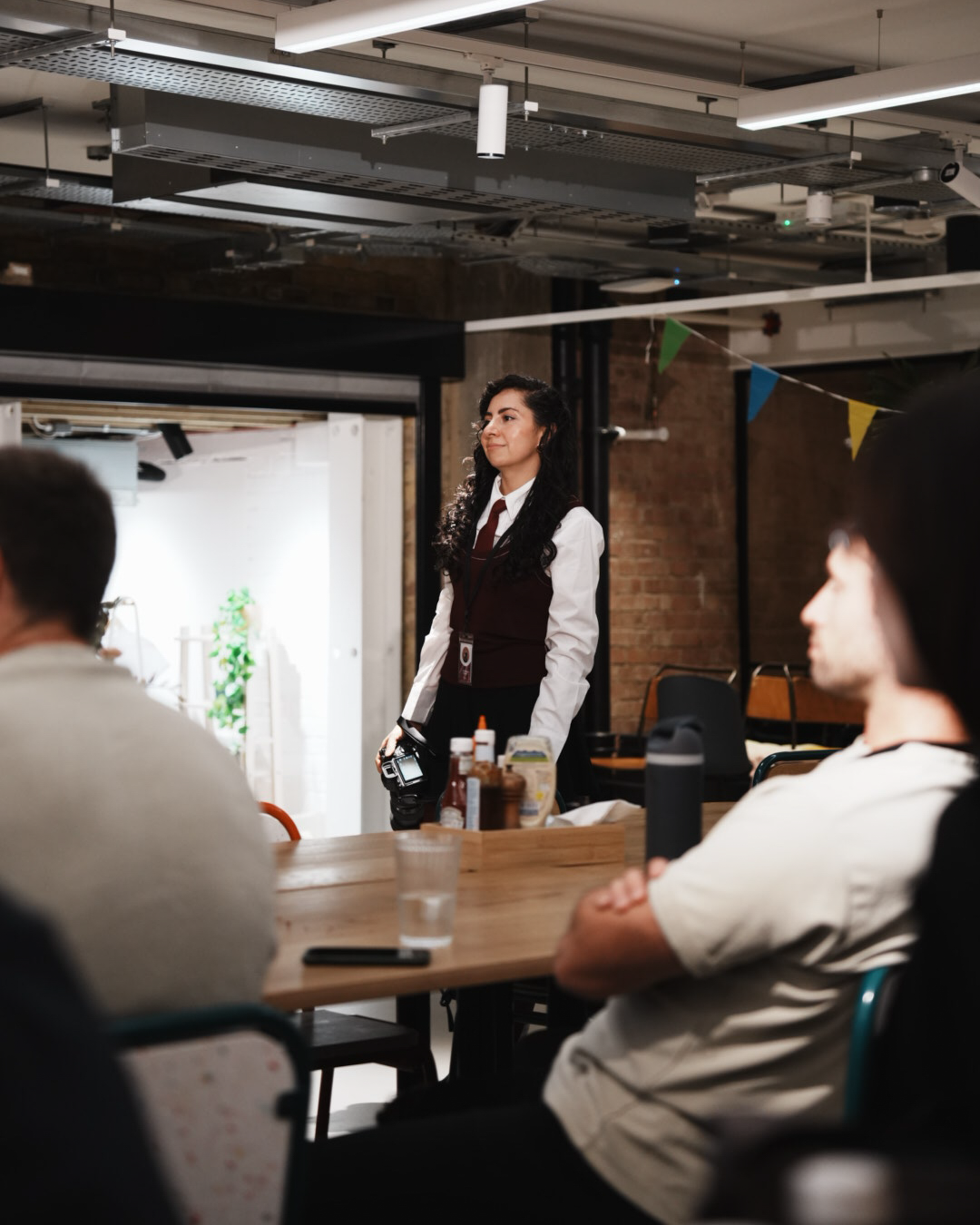 Waitress Serving in a Cozy Cafe Setting · Free Stock Photo