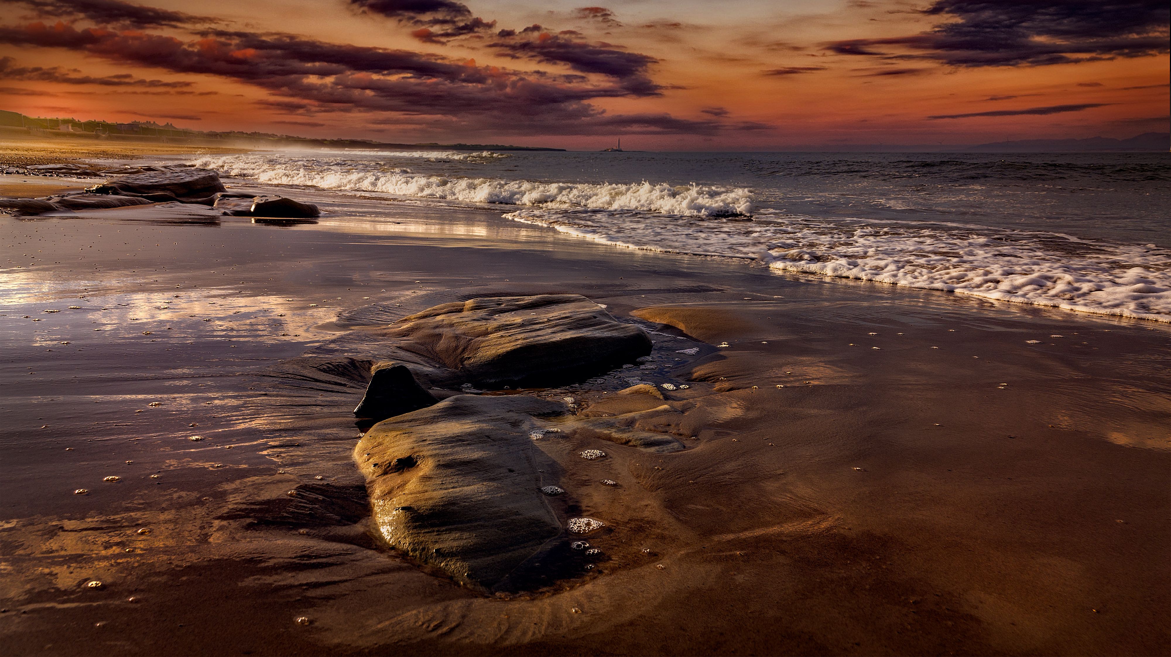 Dramatic Sunset Over Serene Beach Shoreline · Free Stock Photo