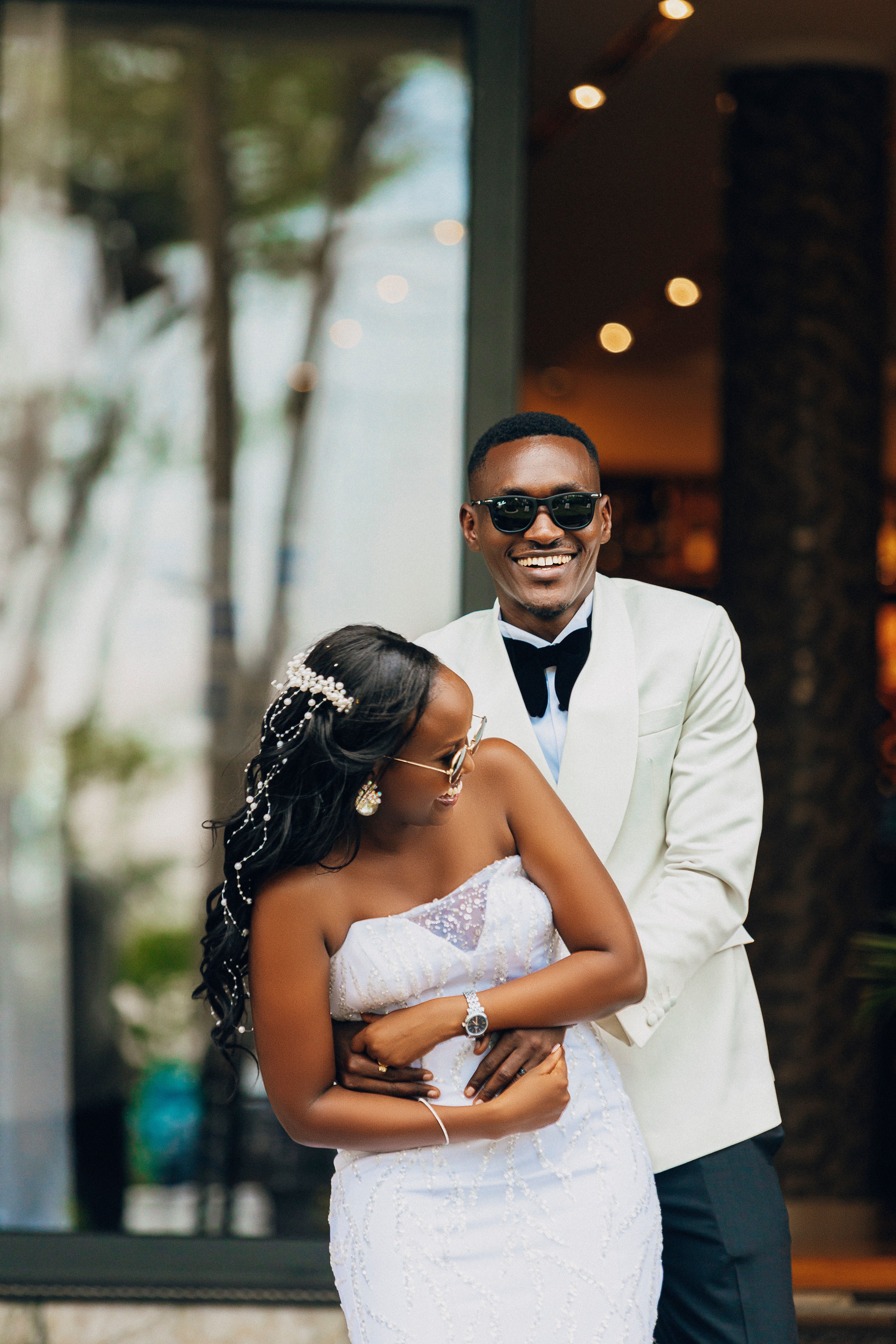Elegant Wedding Couple Embracing Outdoors · Free Stock Photo