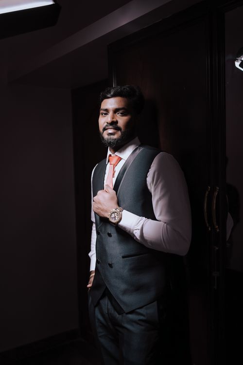 Free Portrait of a groom in formal attire indoors, showcasing elegance and style. Stock Photo