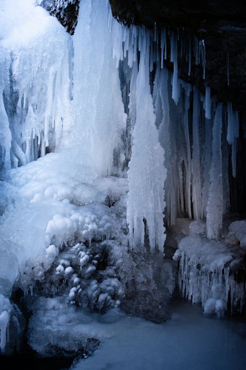 Free Explore the stunning frozen icicles and icy formations in a winter cave setting in Brighton, Utah. Stock Photo