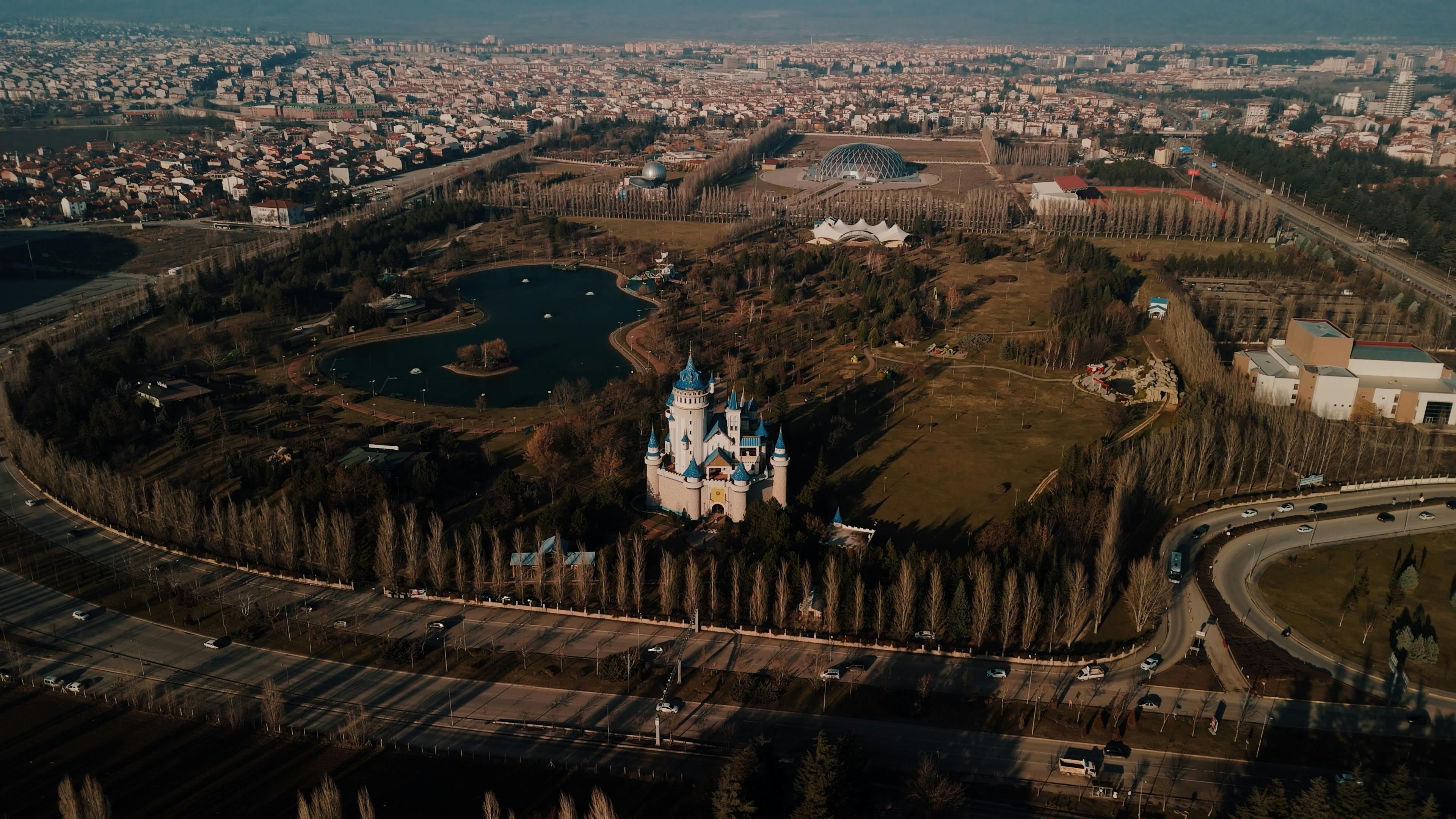 A stunning aerial view of Sazova Park in Eskişehir featuring a fairytale-themed castle.