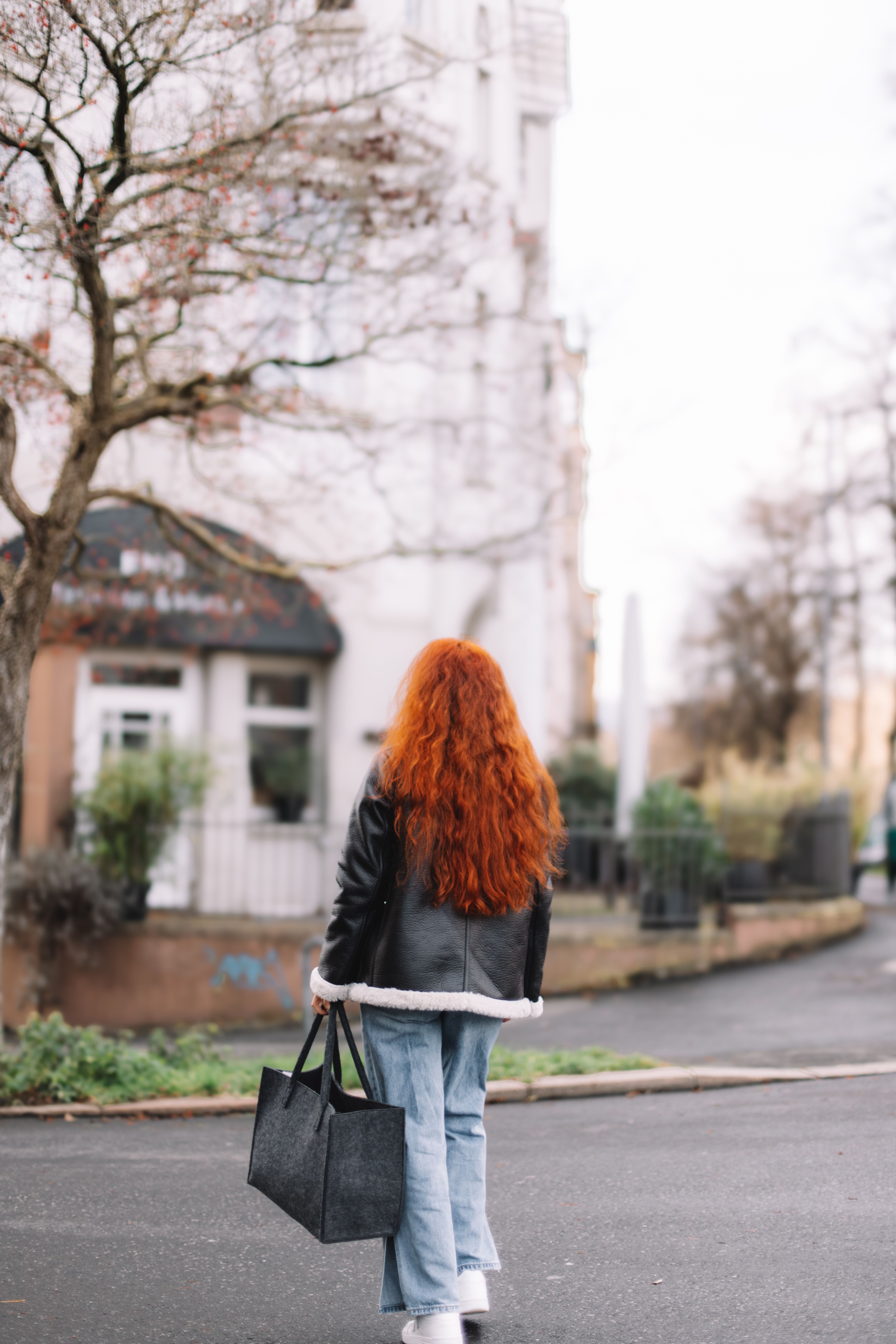Woman with Red Hair Walking on City Street · Free Stock Photo