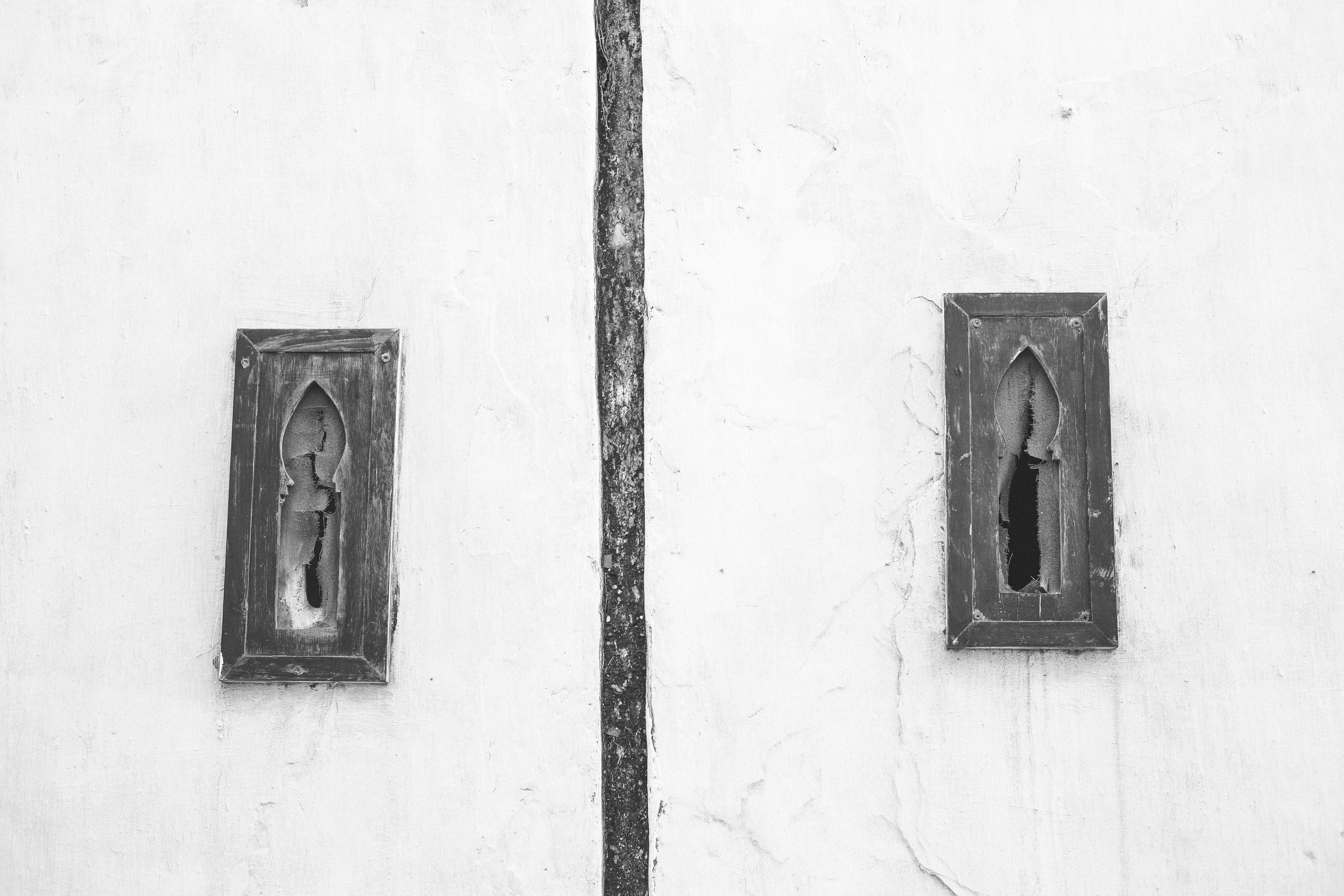 Old Weathered Wall with Keyhole Windows in Rabat · Free Stock Photo