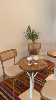 Chic cafe setting featuring wooden furniture and a cozy atmosphere.