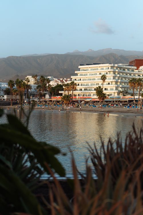 Free Captivating view of a coastal resort in Tenerife, Spain with mountains in the backdrop. Stock Photo