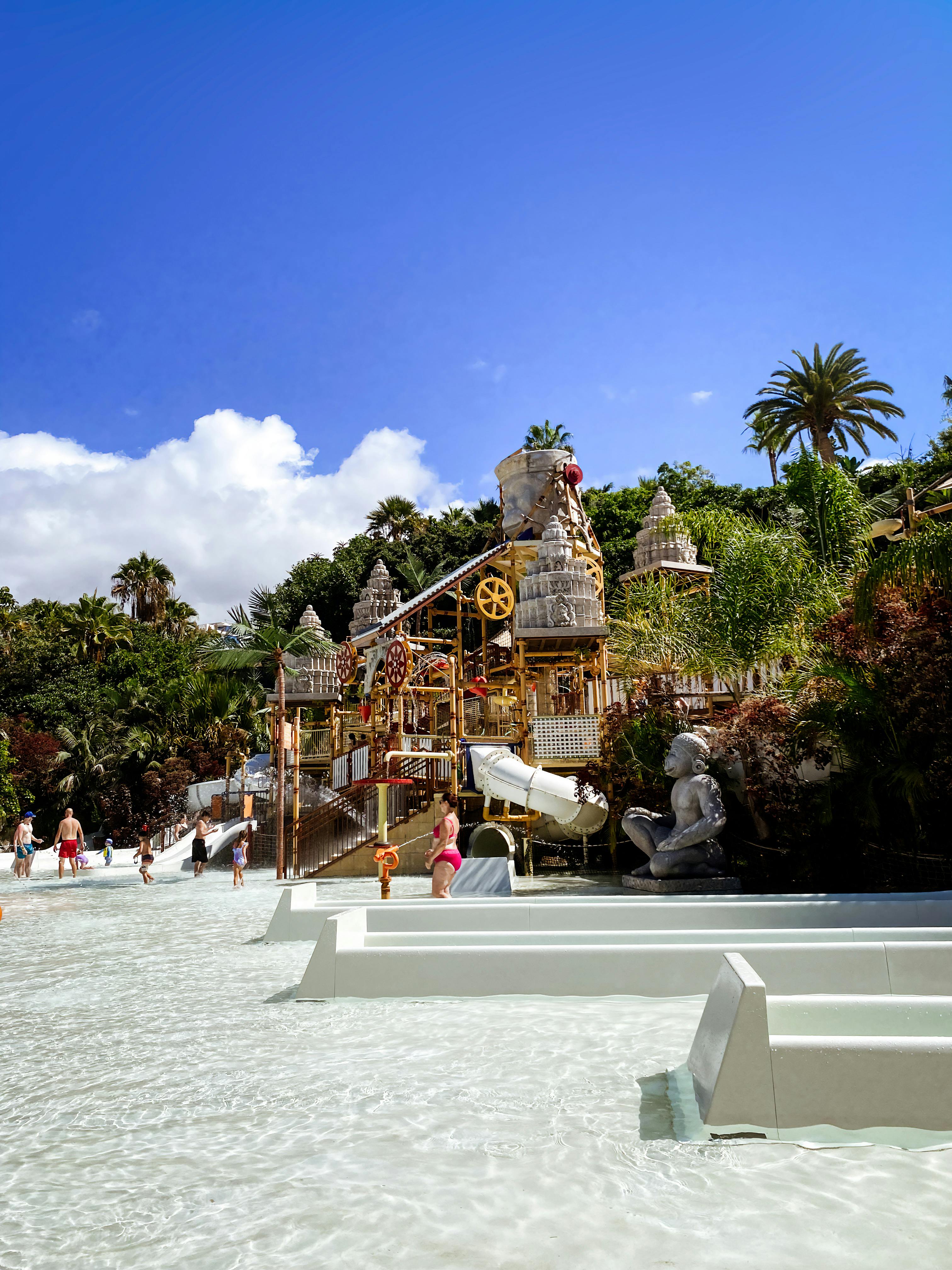Families enjoy a sunny day at the water playground in Siam Park, Costa Adeje.