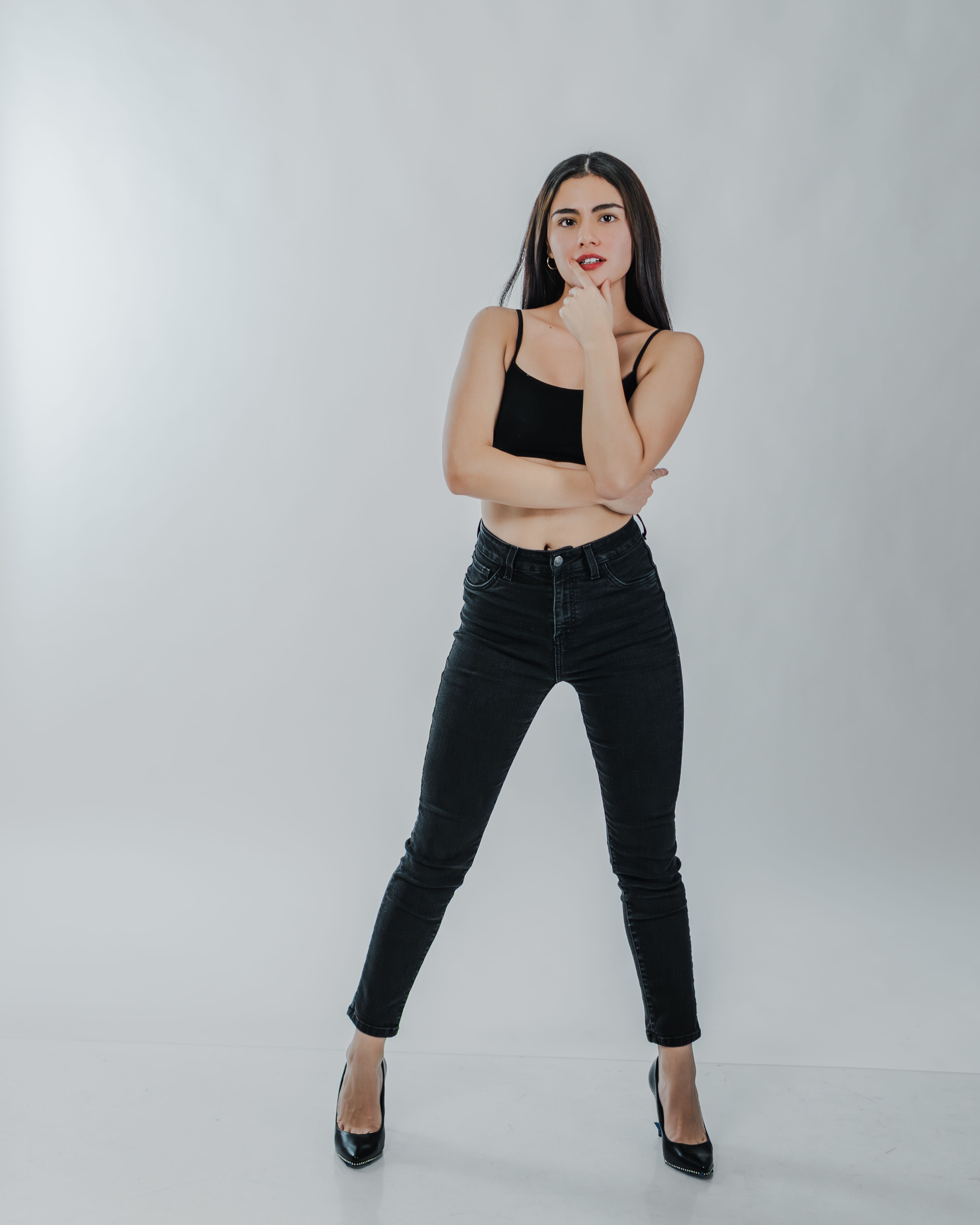 Confident Woman Posing in Black Outfit · Free Stock Photo