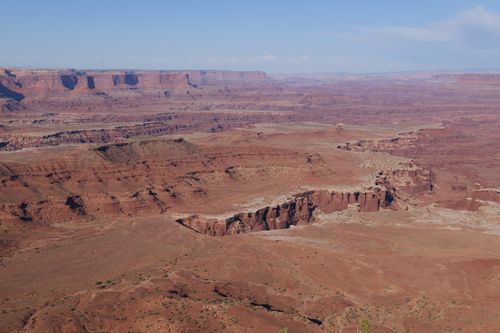 Free Majestic aerial view of vast red rock canyon under a clear blue sky. Stock Photo