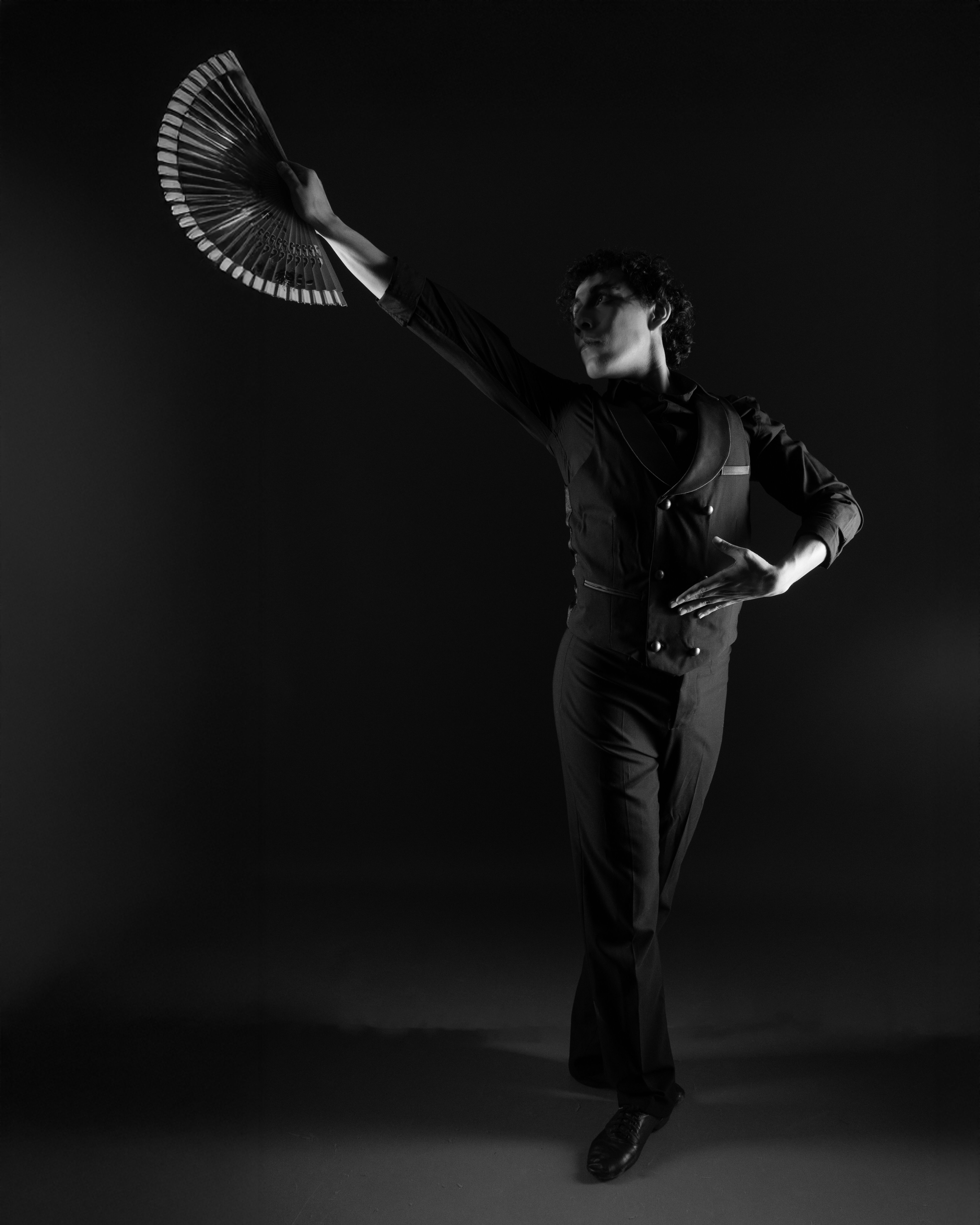 Graceful Male Dancer with Fan in Black and White · Free Stock Photo