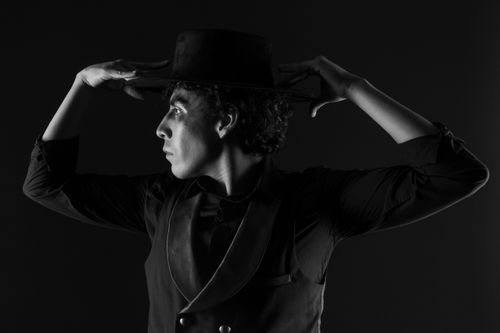 Free Black and white portrait of a male dancer showcasing elegance and contemporary style. Stock Photo