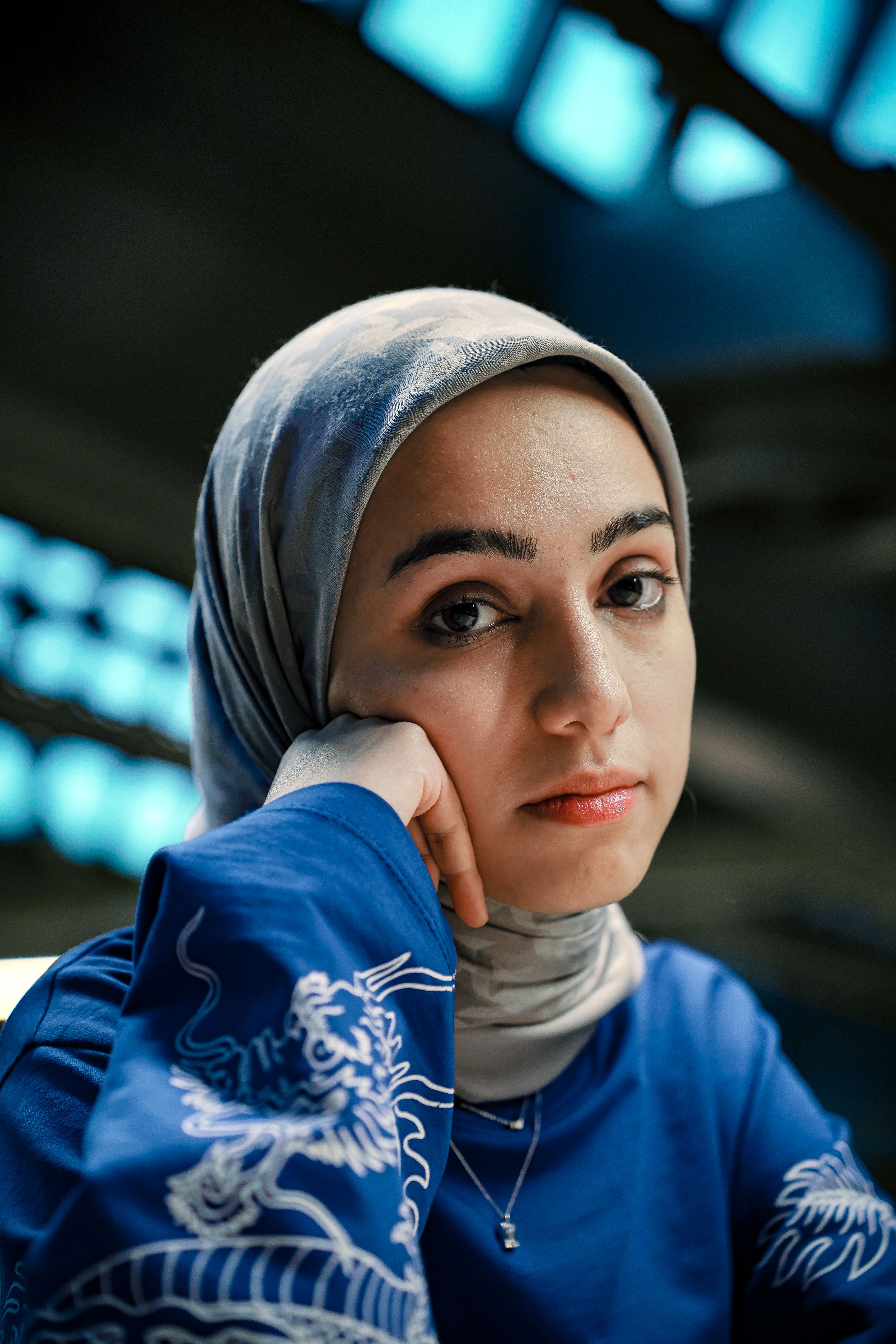 Thoughtful Woman in Blue Hijab Portrait · Free Stock Photo