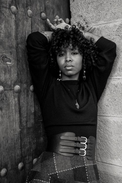 Free Artistic monochrome portrait of a woman posing against a textured wall in Rabat. Stock Photo