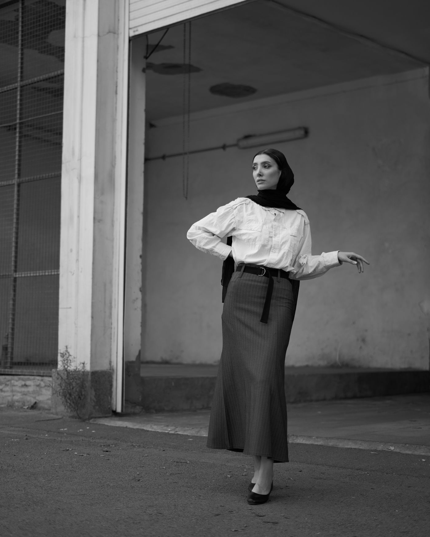 An elegant woman in an urban black and white portrait — the timeless minimalism of CBK style