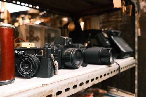 Free A collection of vintage cameras on a shelf at a market in Jakarta, Indonesia. Stock Photo