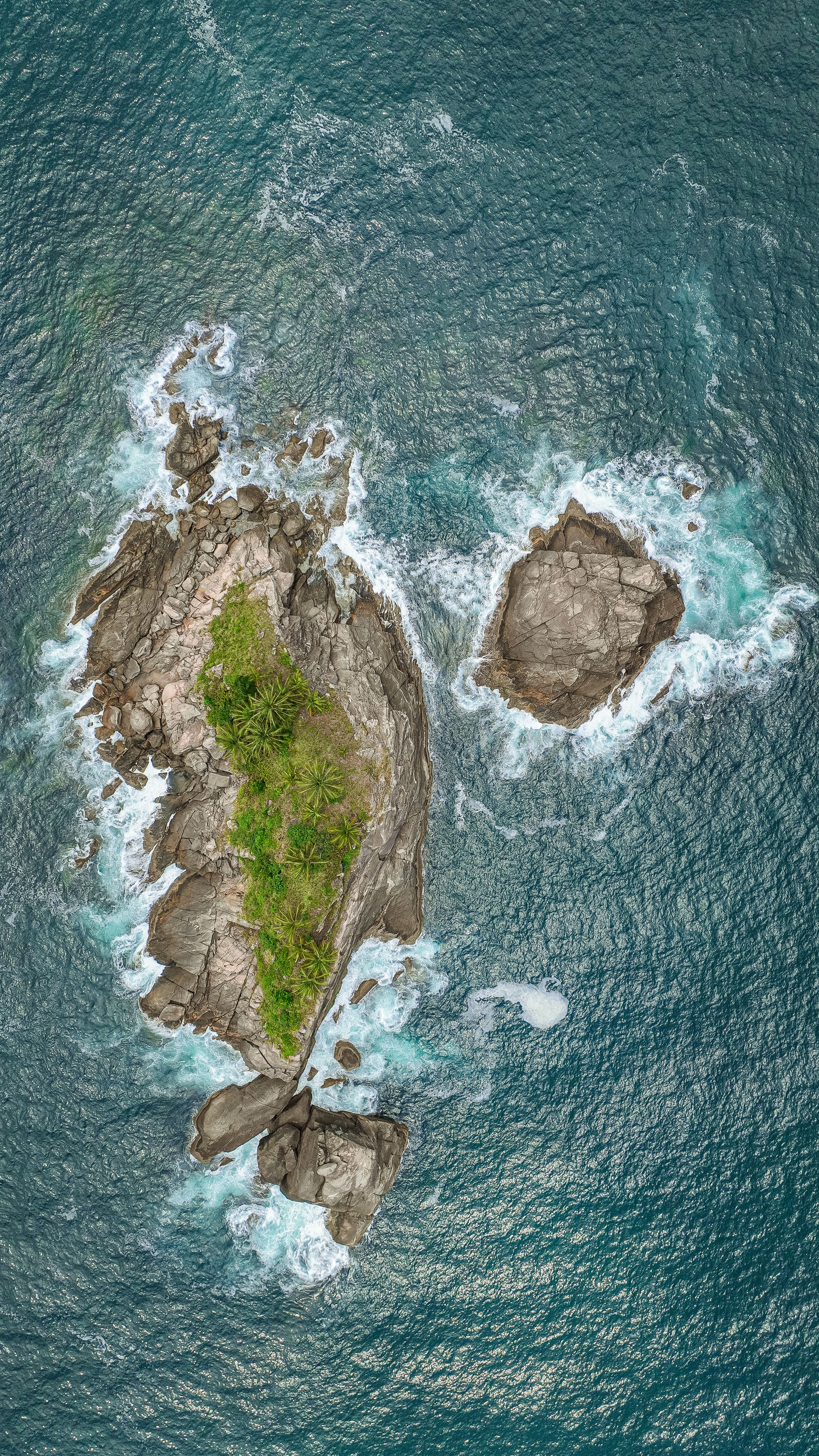 Aerial View of Rocky Island with Lush Greenery · Free Stock Photo