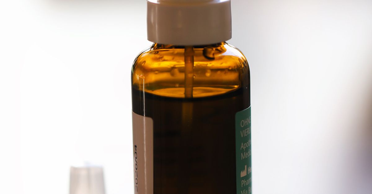 Nasal spray bottle with capsules on a table